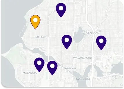 Map with five purple location pins and one yellow selected pin